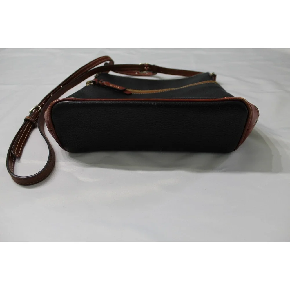 Dooney & Bourke Black Pebbled Leather Crossbody Bag with Tan Trim and Red Lining